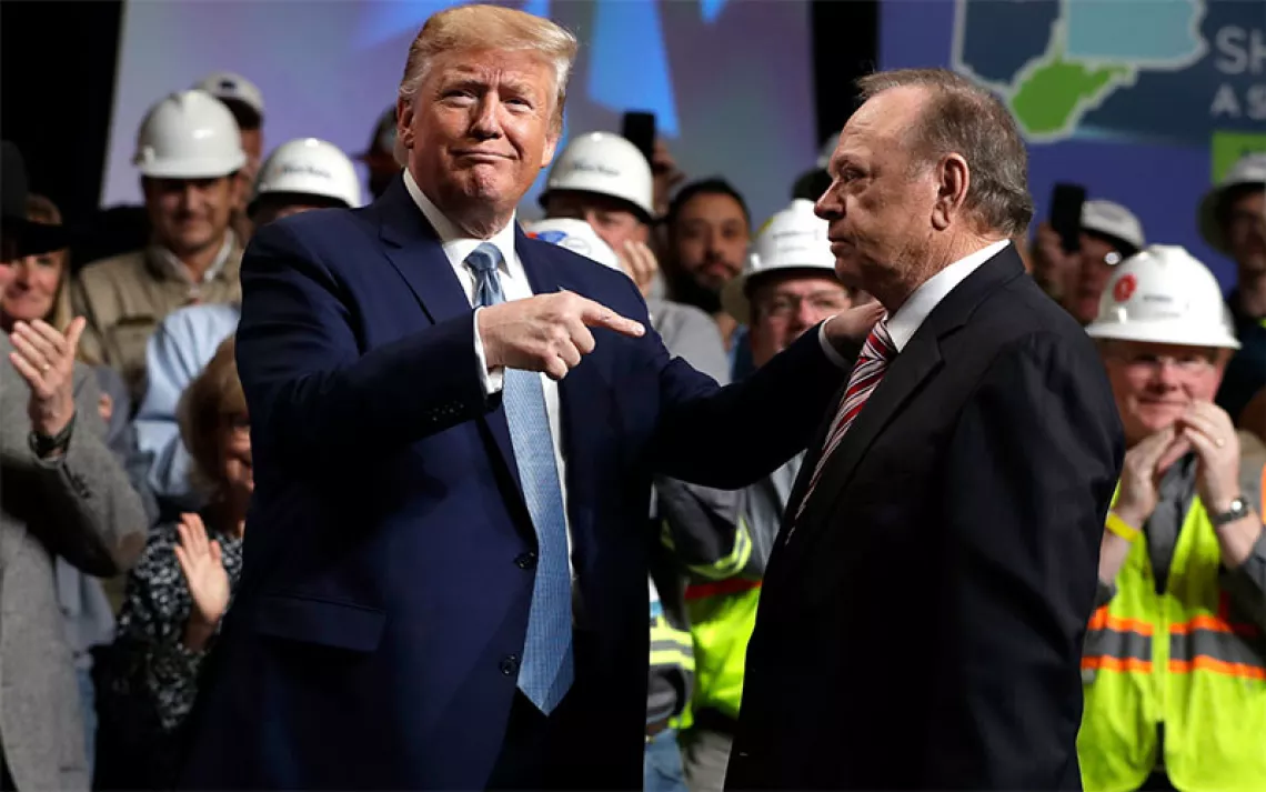 President Donald Trump gestures to Harold Hamm, CEO and majority owner of North Dakota’s largest oil company, Continental Resources, as he arrives to speak at the 9th annual Shale Insight Conference at the David L. Lawrence Convention Center, Wednesday, Oct. 23, 2019, in Pittsburgh.