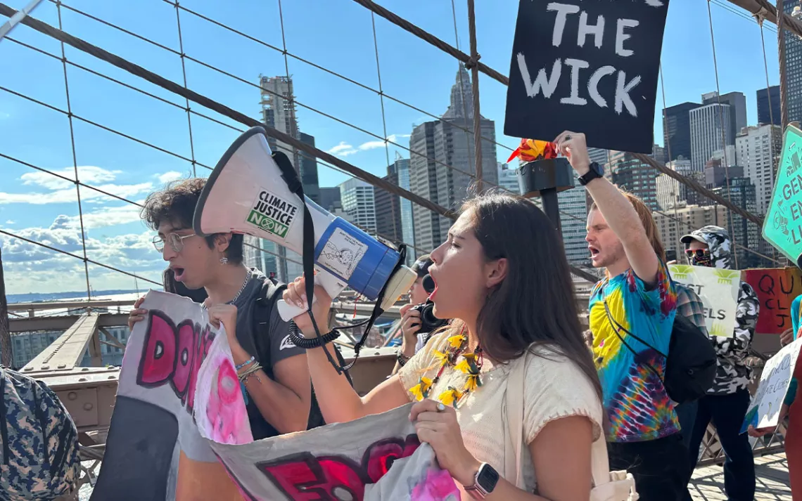 Xiye Bastida, a New York-based climate activist from the Otomi-Toltec Indigenous community in Mexico, marches down the Brooklyn Bridge alongside protesters. 