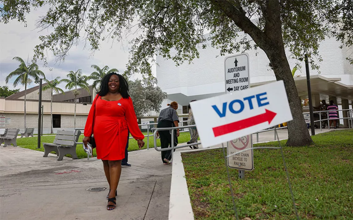 A woman walking on her way to voting