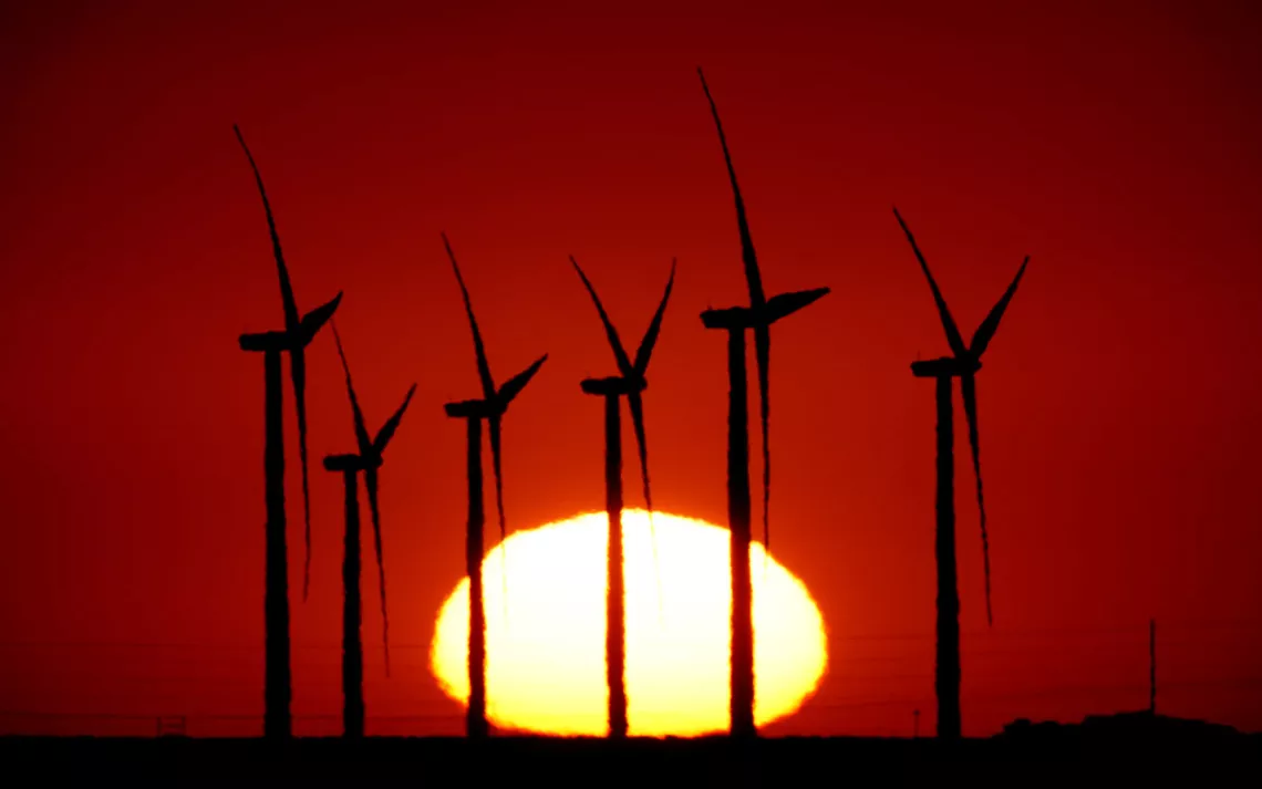 Windmills in front of a setting sun