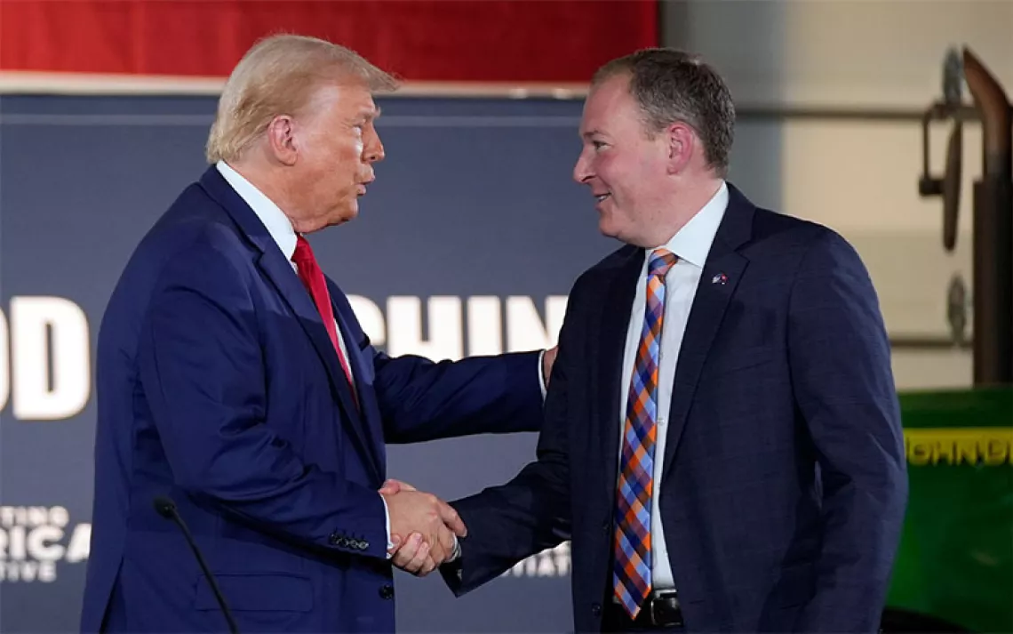 Republican presidential nominee former President Donald Trump greets Lee Zeldin as he arrives to speak at a campaign event at a farm