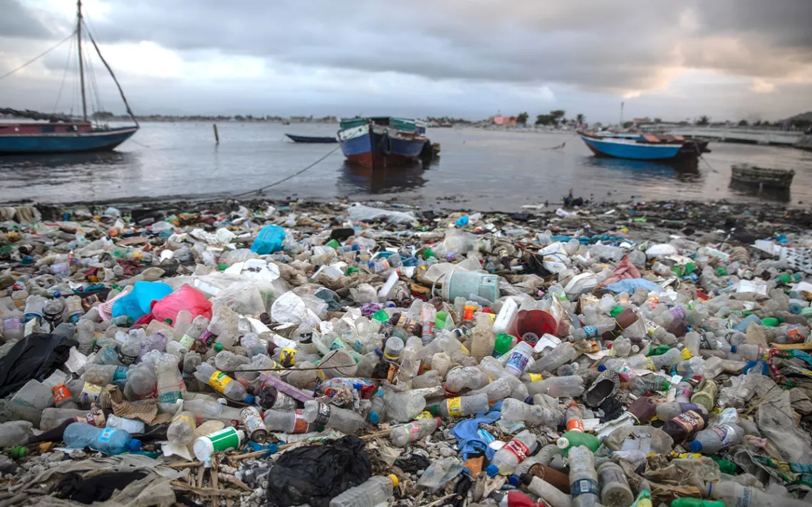 Litter and debris blanket the shoreline in Cap-Haitien, Haiti.