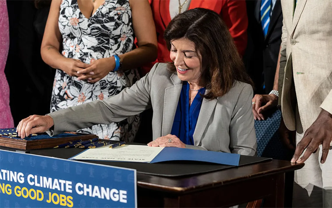 Governor Kathy Hochul signs bills to strengthen New York's commitment to clean energy at Newlab Headquarters at Brooklyn Navy Yard in New York on July 5, 2022. All three bills will strengthen New York's commitment to clean energy development and energy efficiency, while reducing greenhouse gas emissions. |Photo by Lev Radin/Sipa via AP