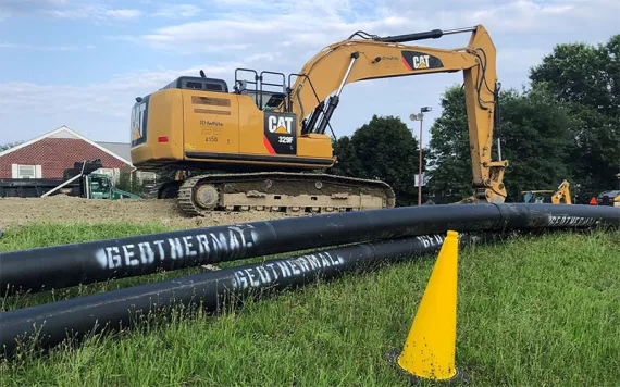 Geothermal construction begins with the installation of main piping at Farley Lot