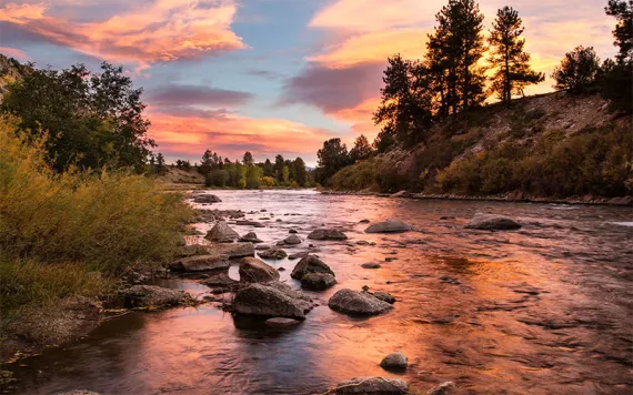 The rising sun reflected on the Colorado portion of the Arkansas River. 