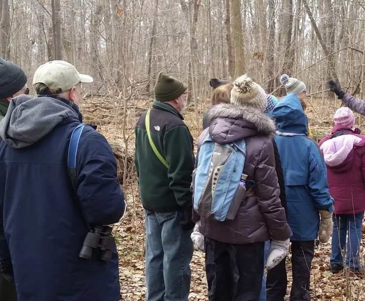 HIkers follow leader in Santa hat