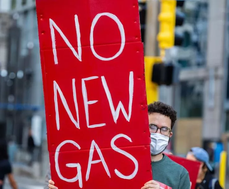Demonstrator holding sign: No New Gas