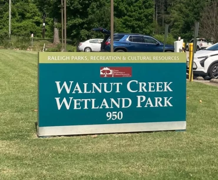 A sign identifying Raleigh's Walnut Creek Wetland Park. By Austin Spence