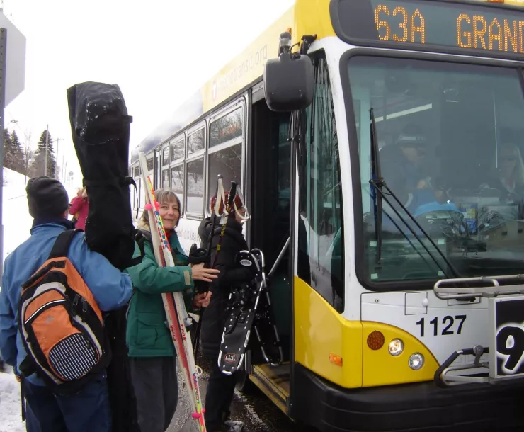 Deb Alper boards a bus with Sierra Club friends for a winter outing to Battle Creek Regional Park in Maplewood (2010). Photo: Joshua Houdek