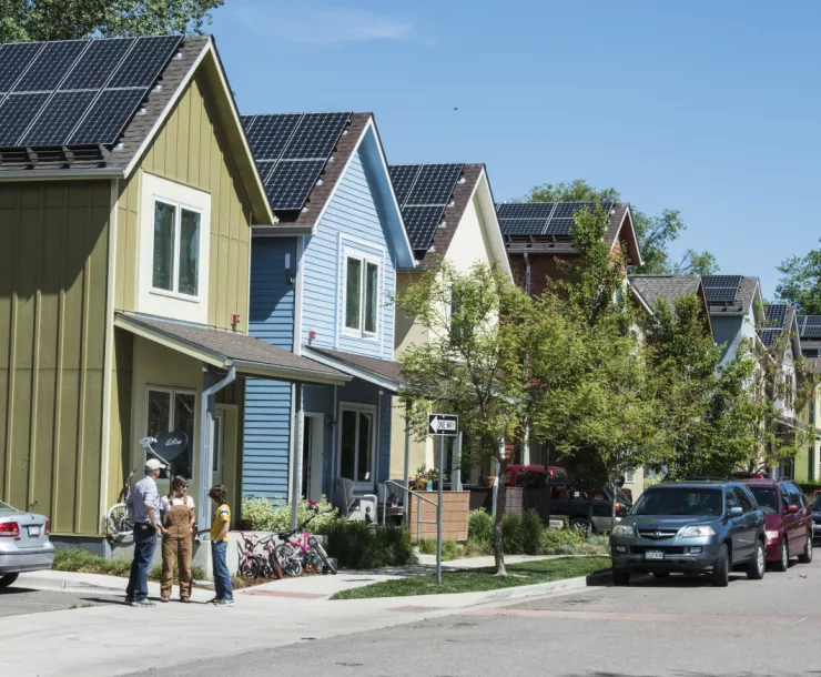 street of houses with solar panels