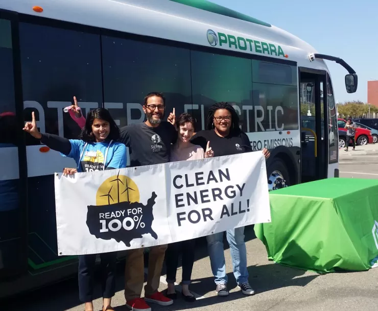 Electric bus photo Sierra Club with banner.png