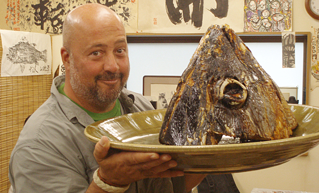 Andrew plates a giant fish head in Tokyo, Japan. | Courtesy of the Travel Channel