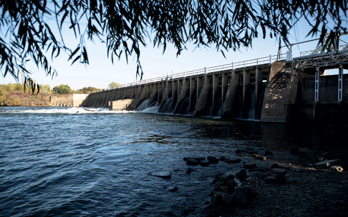 View of the concrete Mendota Dam from the shore.